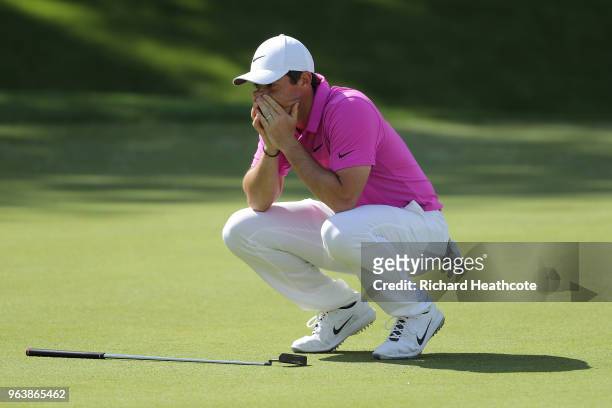 Rory McIlroy of Northern Ireland reacts to a missed eagle putt on the 18th green during the final round of the BMW PGA Championship at Wentworth on...