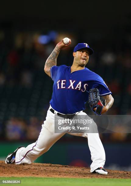 Matt Bush of the Texas Rangers throws in the eight inning against the Kansas City Royals at Globe Life Park in Arlington on May 24, 2018 in...