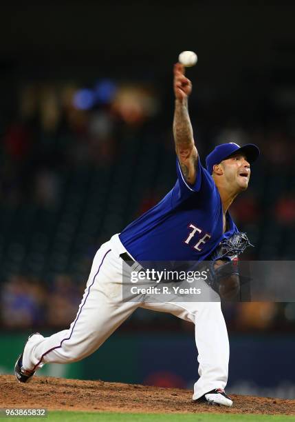 Matt Bush of the Texas Rangers throws in the eight inning against the Kansas City Royals at Globe Life Park in Arlington on May 24, 2018 in...