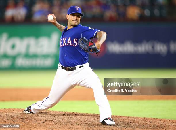 Matt Bush of the Texas Rangers throws in the eight inning against the Kansas City Royals at Globe Life Park in Arlington on May 24, 2018 in...
