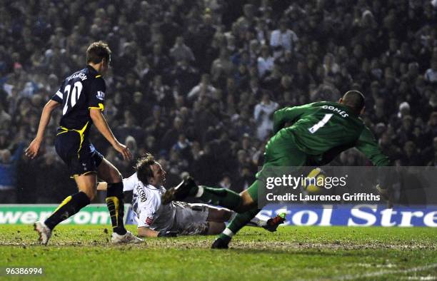 Luciano Becchio of Leeds scores the equaliser past Heurelho Gomes of Spurs during the FA Cup sponsored by E.ON fourth round replay match between...