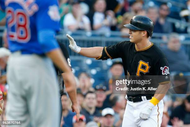 Corey Dickerson of the Pittsburgh Pirates celebrates after hitting a triple in the second inning against the Chicago Cubs at PNC Park on May 30, 2018...