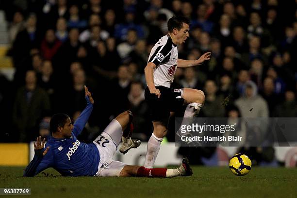 Nicky Shorey of Fulham is tackled by Kevin-Prince Boateng of Portsmouth during the Barclays Premier League match between Fulham and Portsmouth at...