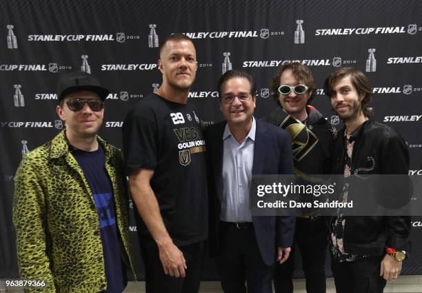 Wayne Sermon, Dan Reynolds, Daniel Platzman and Ben McKee of Imagine Dragons pose with NHL Chief Content Officer Steve Mayer before Game Two of the...