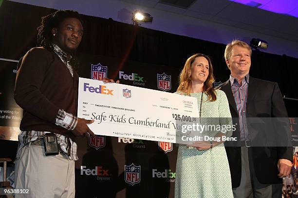 Chris Johnson of the Tennessee Titans named FedEx Ground NFL Player of the Year and former NFL quarterback Phil Simms award a $25,000 donation to...