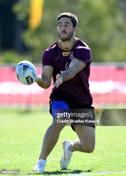 Ben Hunt passes the ball during a Queensland Maroons training session at Sanctuary Cove on May 31, 2018 at the Gold Coast, Australia.