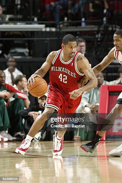 Charlie Bell of the Milwaukee Bucks moves the ball against Trevor Ariza of the Houston Rockets during the game at Toyota Center on January 18, 2010...