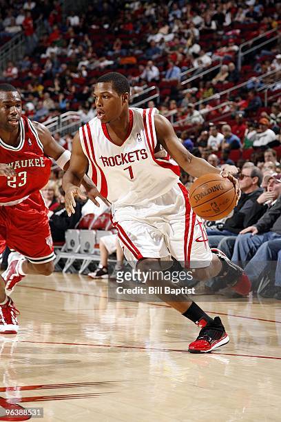 Kyle Lowry of the Houston Rockets moves the ball past Jodie Meeks of the Milwaukee Bucks during the game at Toyota Center on January 18, 2010 in...