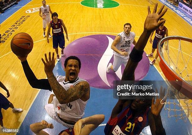 Lawrence Roberts, #4 of Partizan Belgrade competes with Boniface Ndong, #21 of Regal FC Barcelona during the Euroleague Basketball 2009-2010 Last 16...