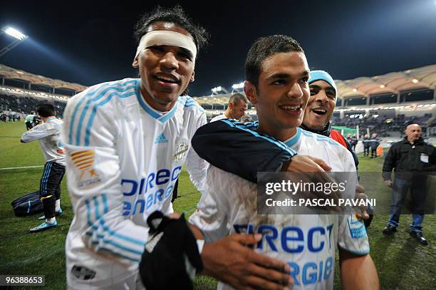 Marseille's forward Hatem Ben Arfa congratulates forward Brandao at the end of the French league cup football match Toulouse vs Marseille during the...