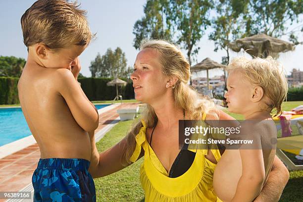 mother comforting young son - annoying brother stock pictures, royalty-free photos & images