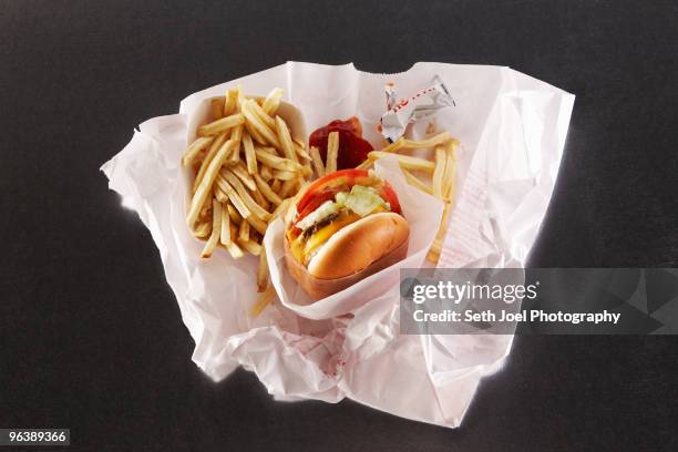 fast food in take out paper bag - french fries overhead stock pictures, royalty-free photos & images