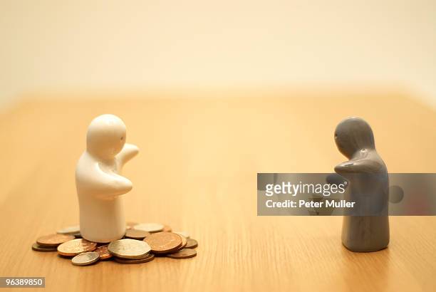 small figures with money - shared prosperity stock pictures, royalty-free photos & images