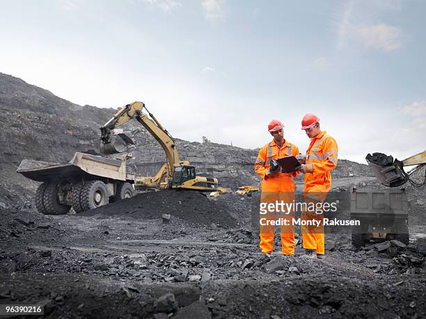 coal miners with clipboard - mijnindustrie stockfoto's en -beelden