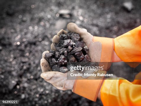 Coal Worker With Handful Of Coal Coal Worker With Handful Of Coal