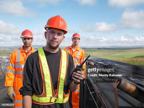 coal workers with conveyor belt - miner helmet portrait stock pictures, royalty-free photos & images