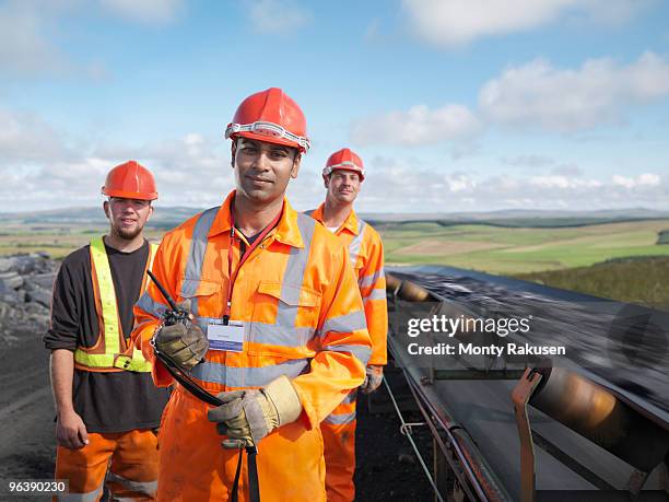 coal workers with conveyor belt - coal miner stock pictures, royalty-free photos & images