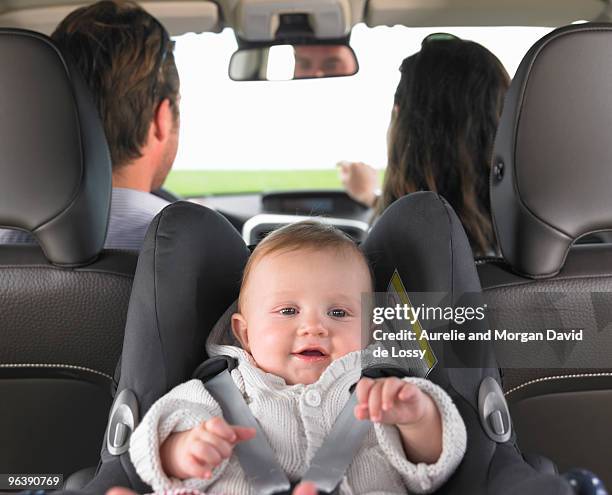 baby in car seat - child car seat stock pictures, royalty-free photos & images