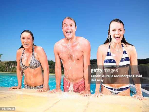 people jumping out of pool - appearance stock-fotos und bilder