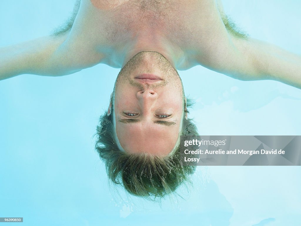 Young man floating in water