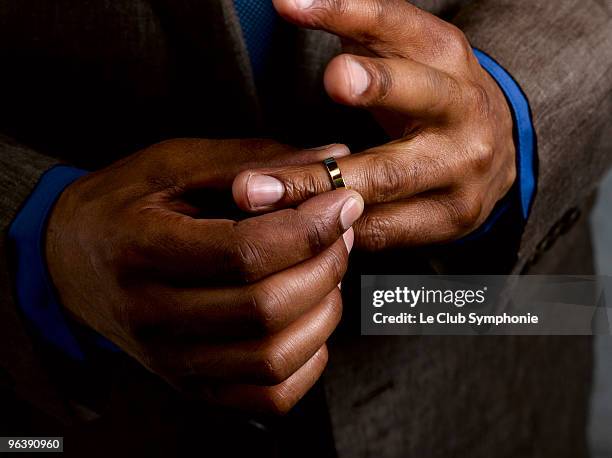 business man putting on wedding band - wedding ring stock pictures, royalty-free photos & images