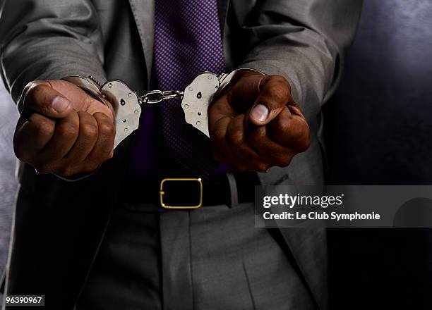 business man in handcuffs - handcuffs stock pictures, royalty-free photos & images