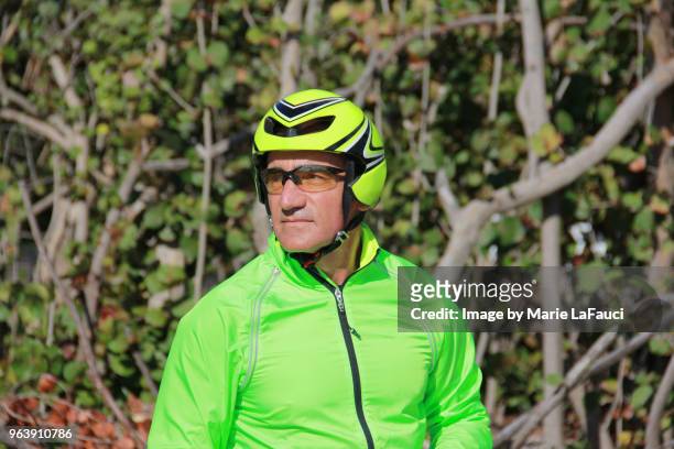 portrait of confident man with bicycle helmet - marie lafauci stock pictures, royalty-free photos & images