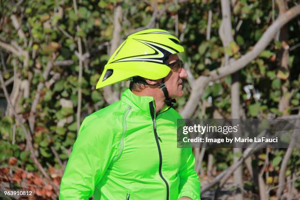 side view of athletic man with bicycle helmet - marie lafauci stock pictures, royalty-free photos & images