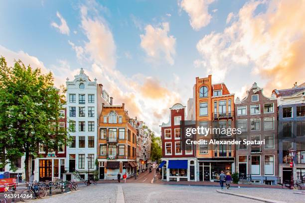 amsterdam skyline with traditional dutch houses during sunset, holland, netherlands - amsterdam bildbanksfoton och bilder