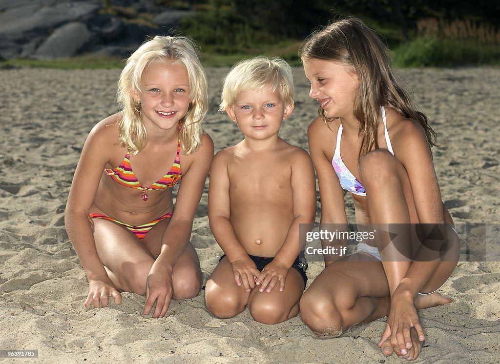 Portrait of siblings on a beach