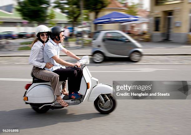 couple on scooter - couple scooter stock pictures, royalty-free photos & images