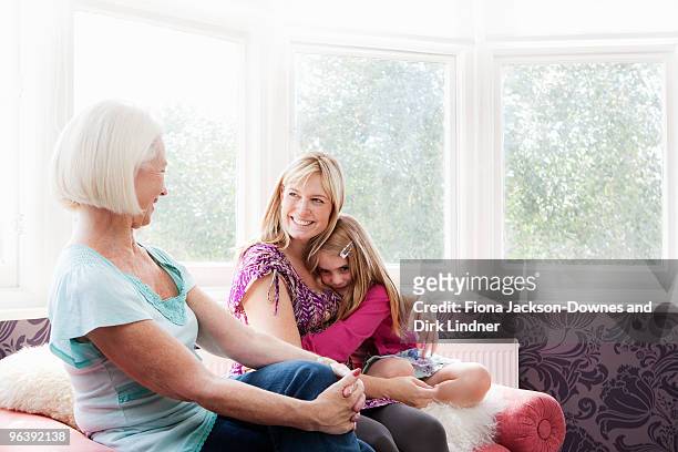 a grandmother, mother and daughter - chelsea pensionär stock-fotos und bilder