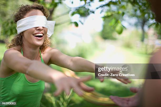 woman blindfolded - blinddoek stockfoto's en -beelden