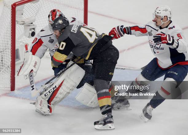 Ryan Carpenter of the Vegas Golden Knights collides with Braden Holtby of the Washington Capitals during the second period in Game Two of the 2018...