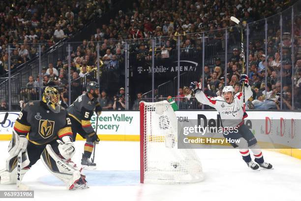 Andre Burakovsky of the Washington Capitals celebrates a second-period goal by teammate Brooks Orpik as Marc-Andre Fleury of the Vegas Golden Knights...