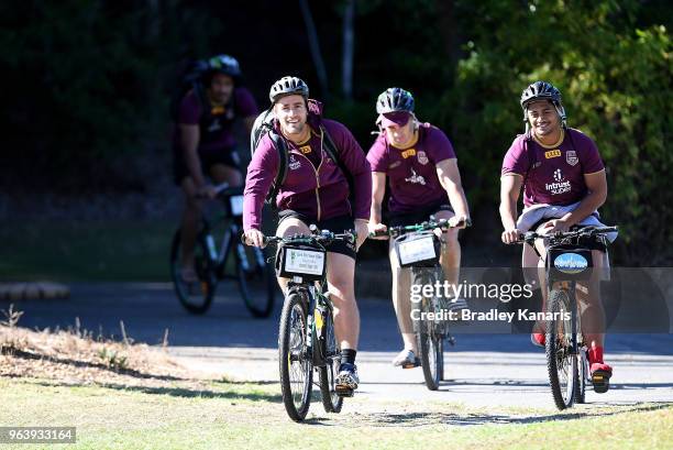 Andrew McCullough and team mates ride their bikes during a Queensland Maroons training session at Sanctuary Cove on May 31, 2018 at the Gold Coast,...