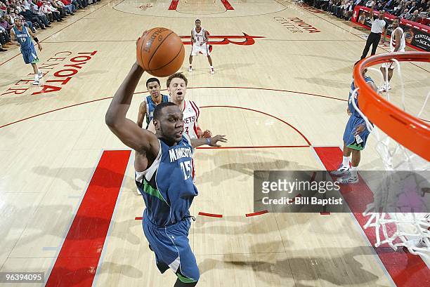 Al Jefferson of the Minnesota Timberwolves puts up a shot against David Andersen of the Houston Rockets during the game on January 13, 2010 at the...