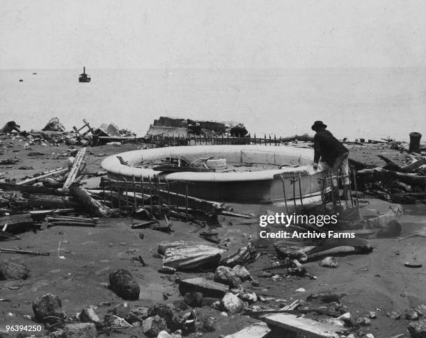 The ruins of the city fountain and the base of the lighthouse after the eruption of the Mount Pelee volcano on May 10, 1902 at St. Pierre, Martinique.
