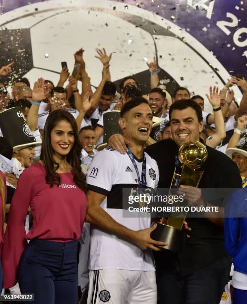Olimpia's captain Roque Santa Cruz and the President of Oliimpia Marcos Trovato, celebrate with the trophy after winning the Paraguayan apertura 2018...