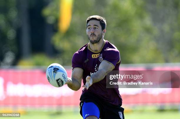 Ben Hunt passes the ball during a Queensland Maroons training session at Sanctuary Cove on May 31, 2018 at the Gold Coast, Australia.