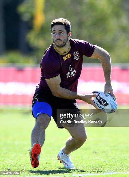 Ben Hunt passes the ball during a Queensland Maroons training session at Sanctuary Cove on May 31, 2018 at the Gold Coast, Australia.