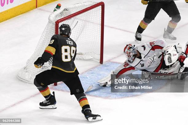 Braden Holtby of the Washington Capitals makes a diving stick save on a shot by Alex Tuch of the Vegas Golden Knights during the third period in Game...