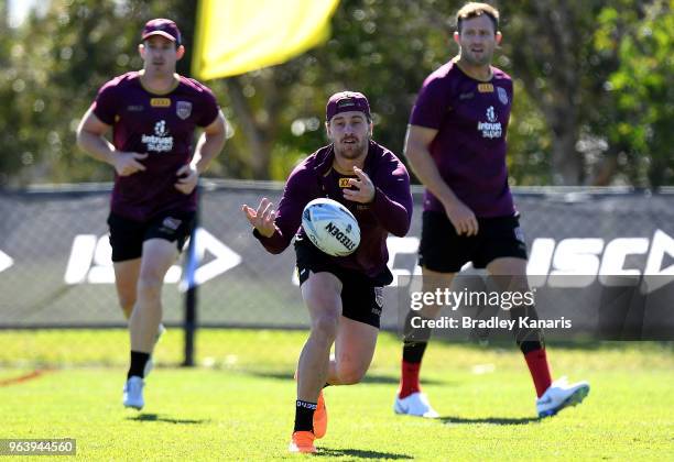 Cameron Munster passes the ball during a Queensland Maroons training session at Sanctuary Cove on May 31, 2018 at the Gold Coast, Australia.