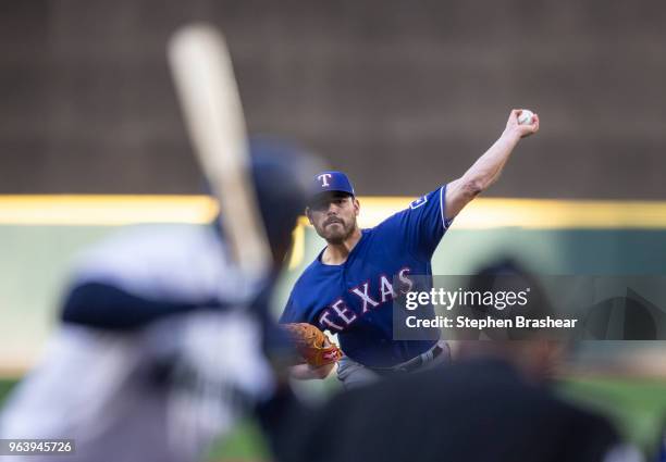 Starter Matt Moore of the Texas Rangers delivers a pitch during the first inning of a game against the Seattle Mariners at Safeco Field on May 30,...