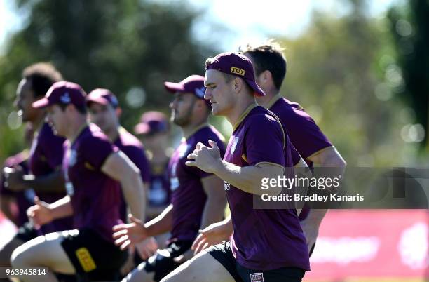 Coen Hess and team mates warm-up during a Queensland Maroons training session at Sanctuary Cove on May 31, 2018 at the Gold Coast, Australia.