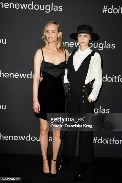 Amber Valletta and Cara Delevingne during the Douglas X Peter Lindbergh campaign launch at ewerk on May 30, 2018 in Berlin, Germany.