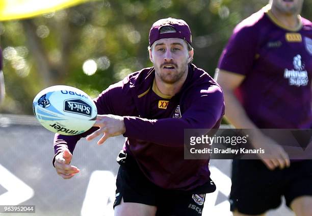 Cameron Munster passes the ball during a Queensland Maroons training session at Sanctuary Cove on May 31, 2018 at the Gold Coast, Australia.
