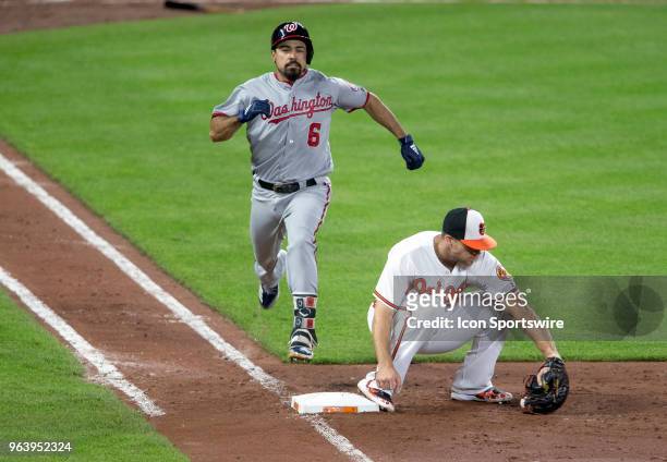 Washington Nationals third baseman Anthony Rendon doesn't beat the throw to Baltimore Orioles first baseman Chris Davis in the sixth inning during a...