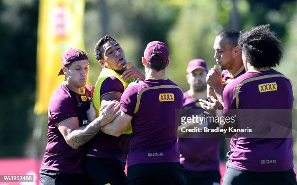 Joe Ofahengaue takes on the defence during a Queensland Maroons training session at Sanctuary Cove on May 31, 2018 at the Gold Coast, Australia.