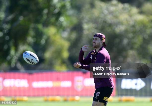 Cameron Munster passes the ball during a Queensland Maroons training session at Sanctuary Cove on May 31, 2018 at the Gold Coast, Australia.